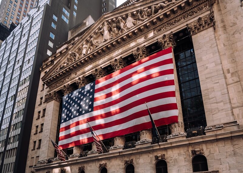 a large american flag on the side of a building