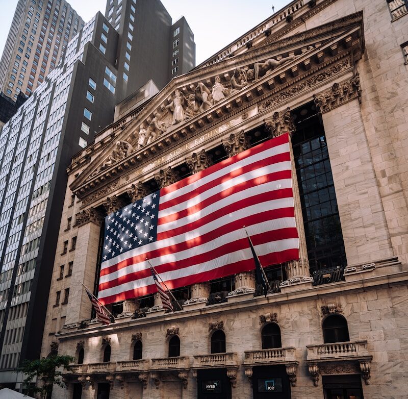 a large american flag on the side of a building